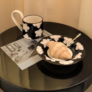 Botanical cup and saucer with a croissant