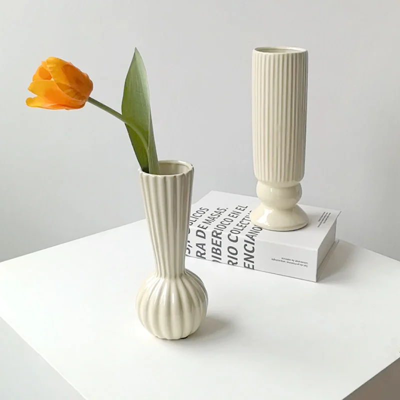 Cream ribbed ceramic vases with flowers